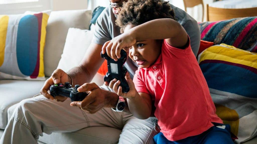 A father and son playing video games.