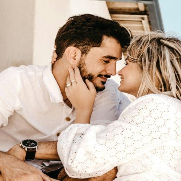 A couple smiling at each other