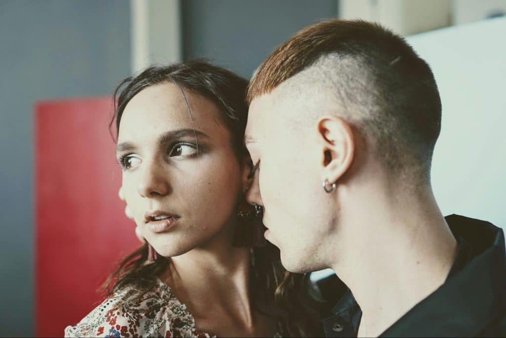 A man getting too close to a woman