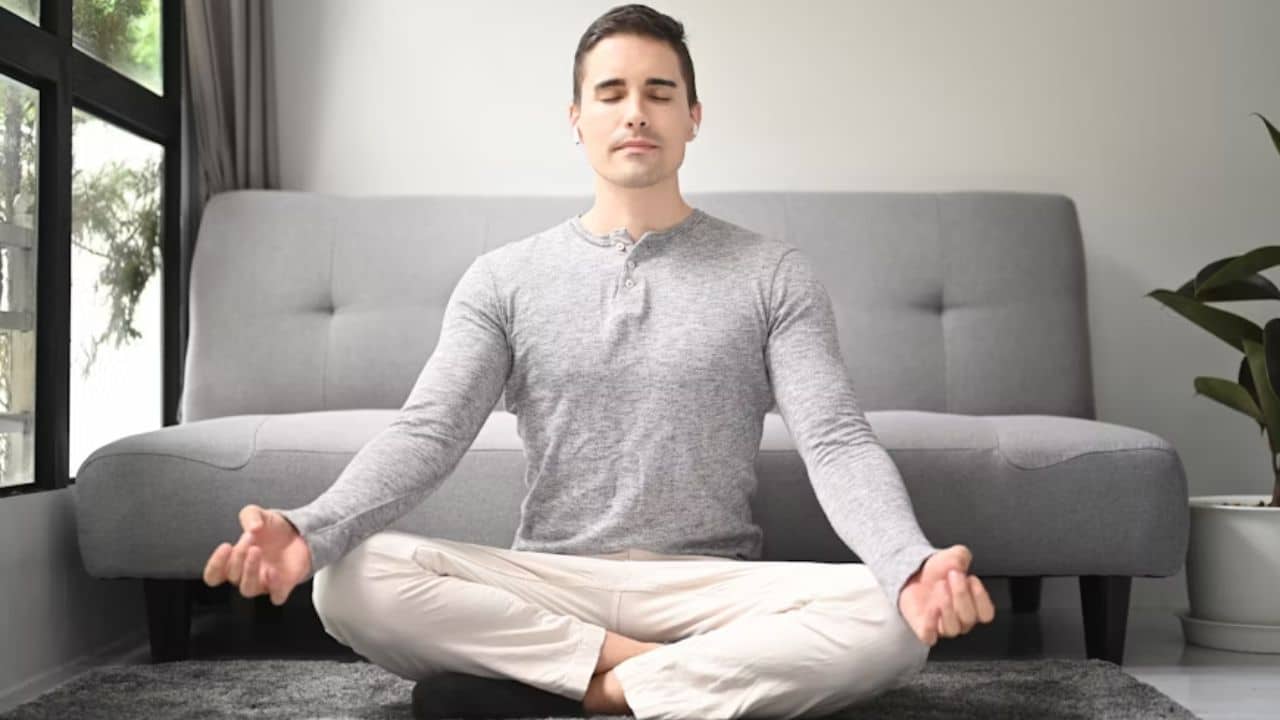 Man meditating, calming his thoughts through mindful reflection.