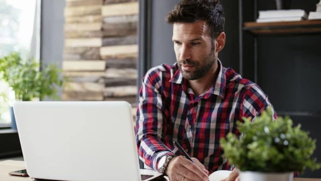 Man looking guilty from hidden financial habit.