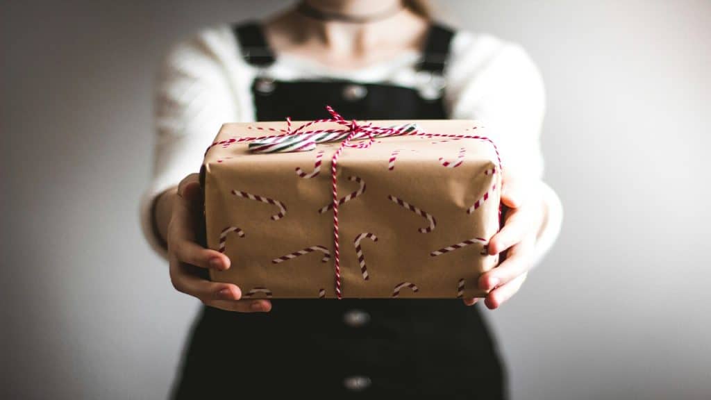 A person offering a gift