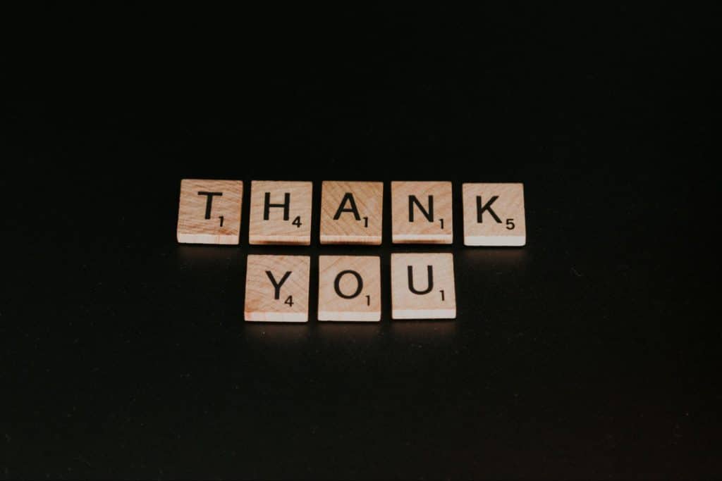 A picture of scrabble letters saying “thank you”