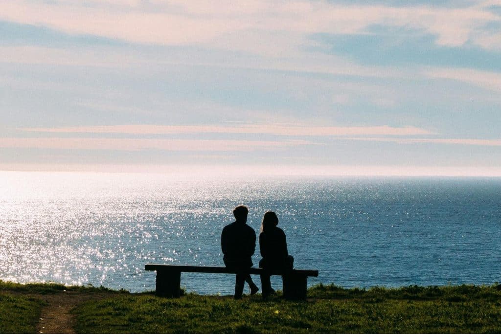 A man and woman watching a beautiful view.