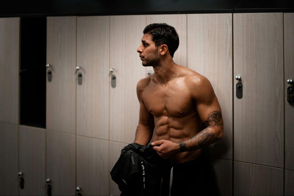 A man preparing for a shower after the gym.