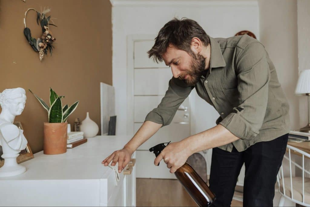 A man cleaning a table