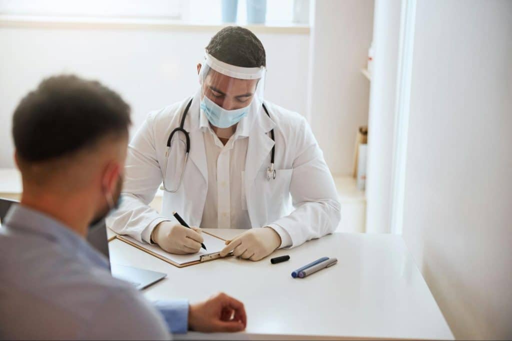 A man getting a consultation from a doctor