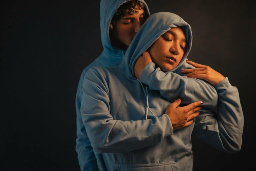 A man hugging a woman tight 