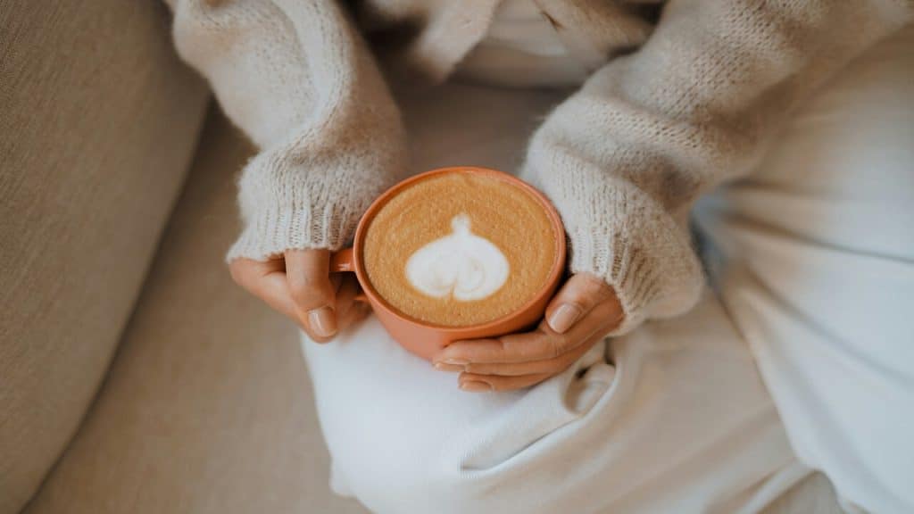 A woman having coffee at home