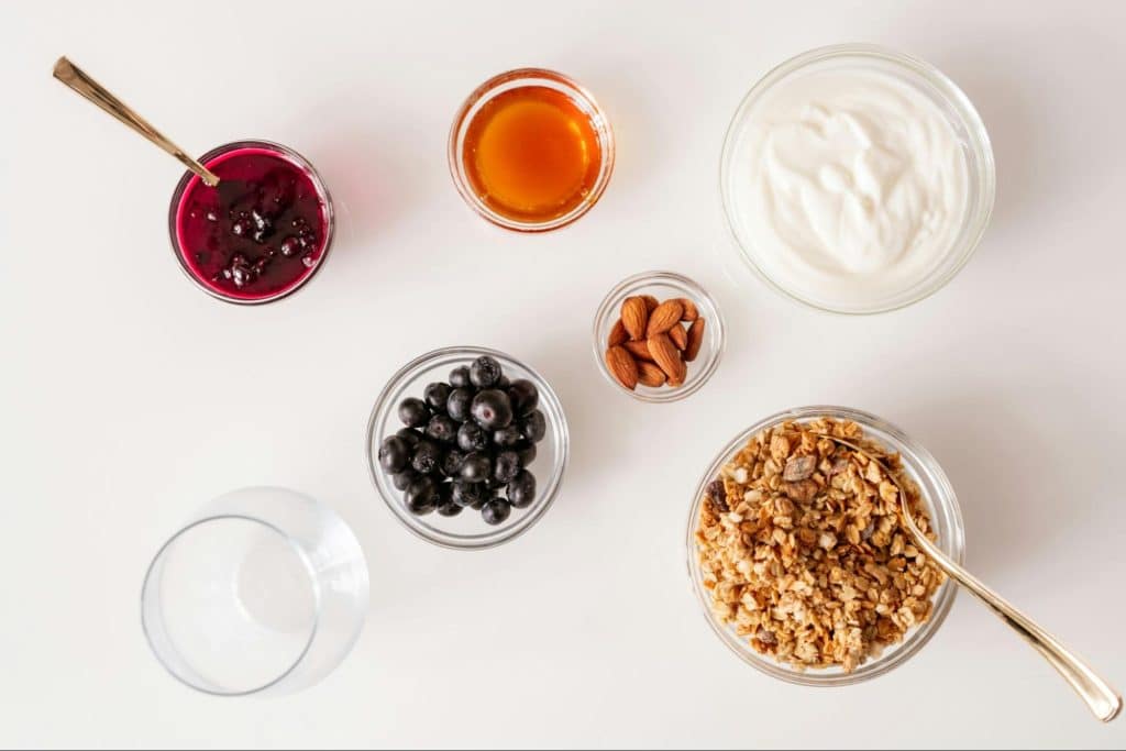 A picture of a greek yogurt with fruits.