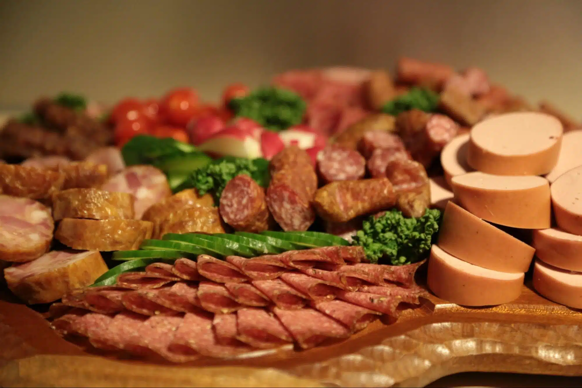 A sliced meat on a charcuterie board.