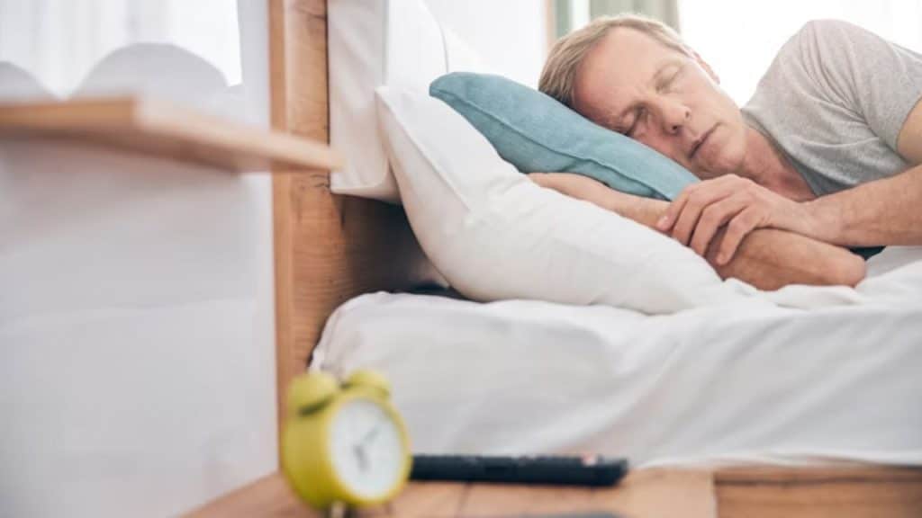 Man in deep sleep promoting cognitive and physical recovery