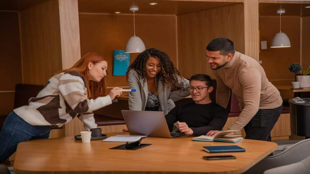 An employee explaining something to his colleagues.