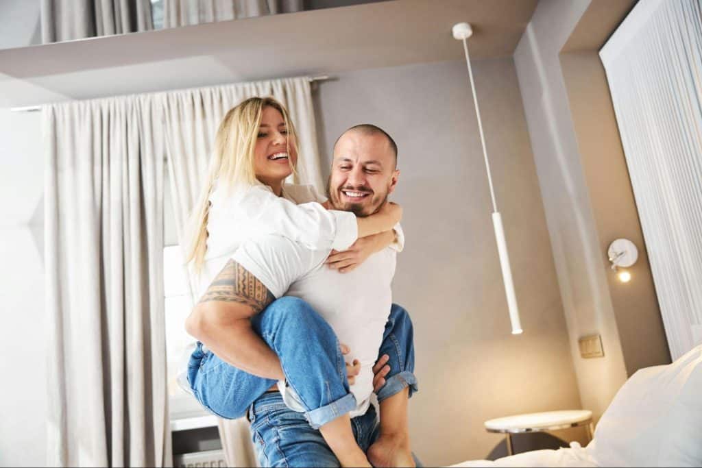 A picture of a husband carrying his wife