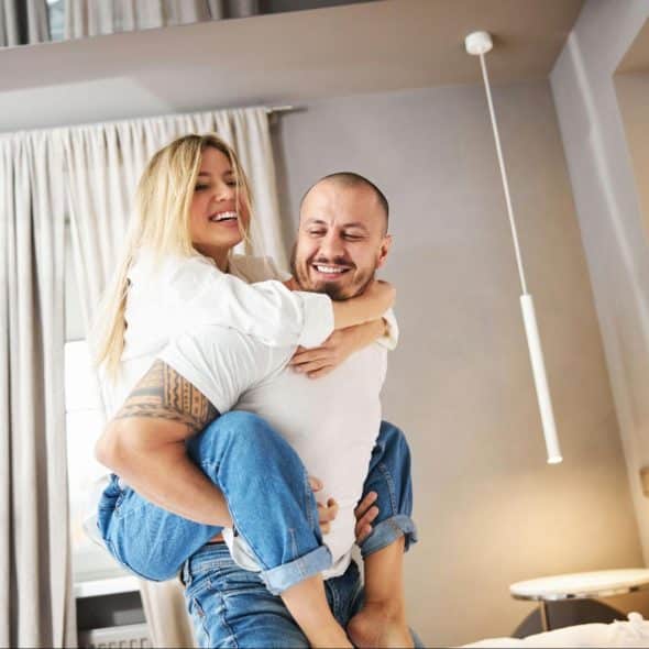 A picture of a husband carrying his wife
