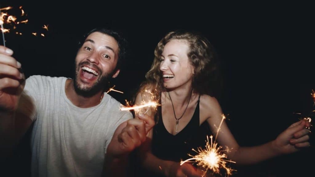 Couple celebrating after finishing a successful escape room challenge.
