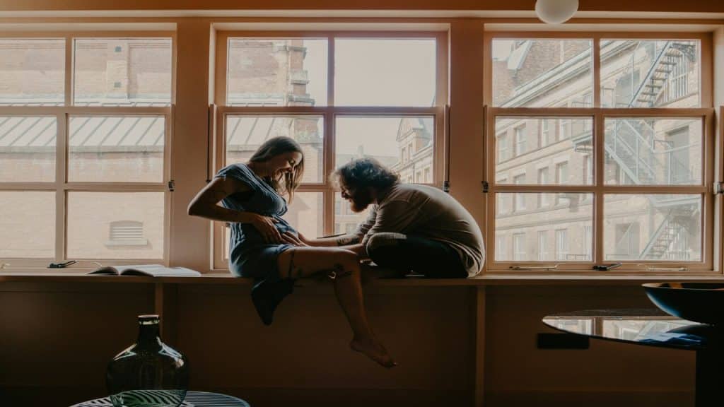 A couple sitting by the window