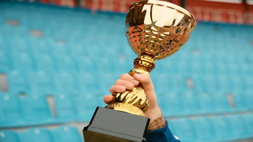 A person holding a trophy.