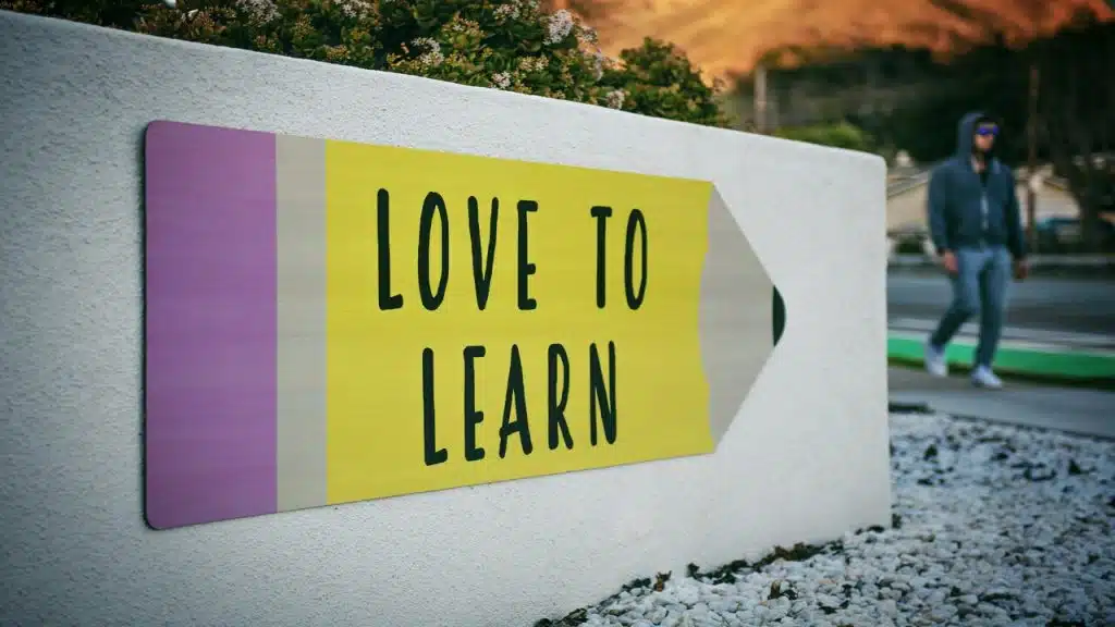 A sign saying “learn to love”.