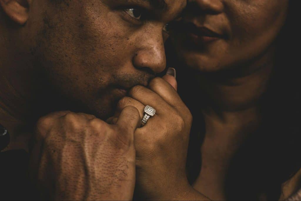 A man kissing a woman’s hand