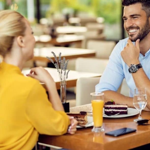 Man smiling while looking at his partner during a casual moment