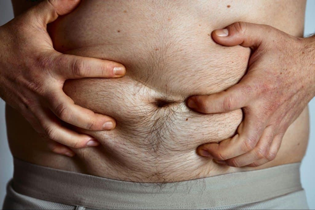 A man holding his tummy