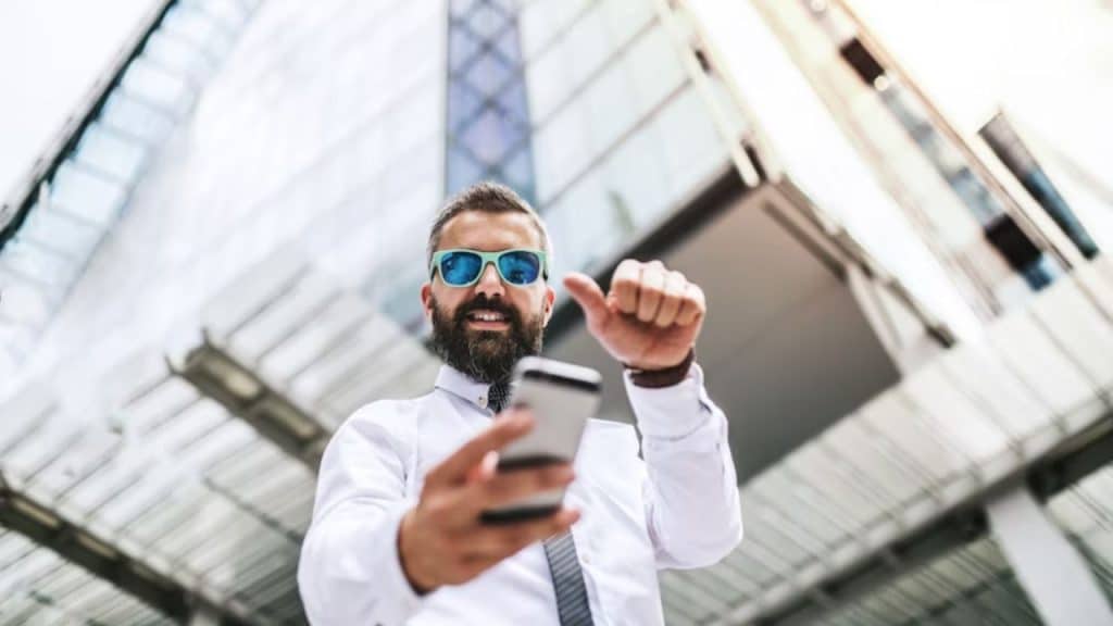 A man smiling after adjusting social media settings