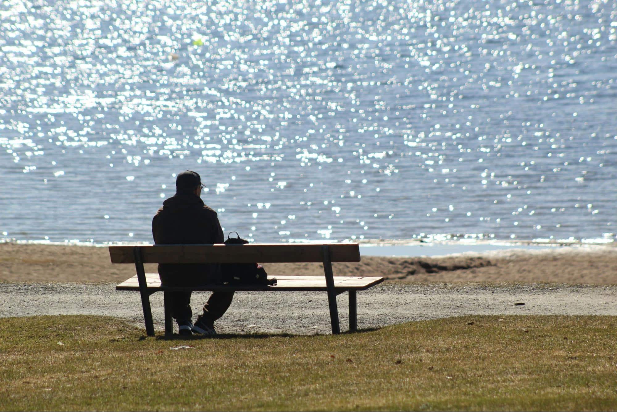 A man sitting alone at the bench.