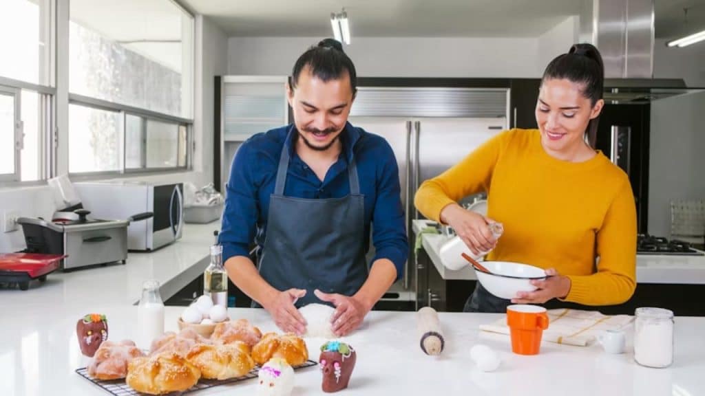 Couple enjoying connection through cooking side by side.