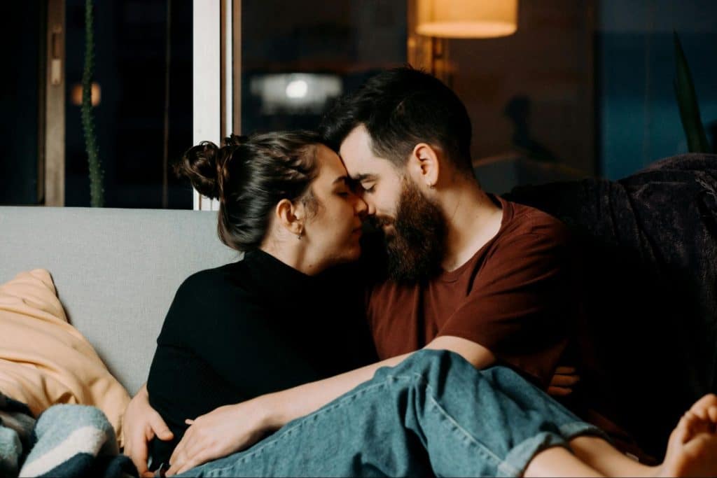 A man and woman facing each other 