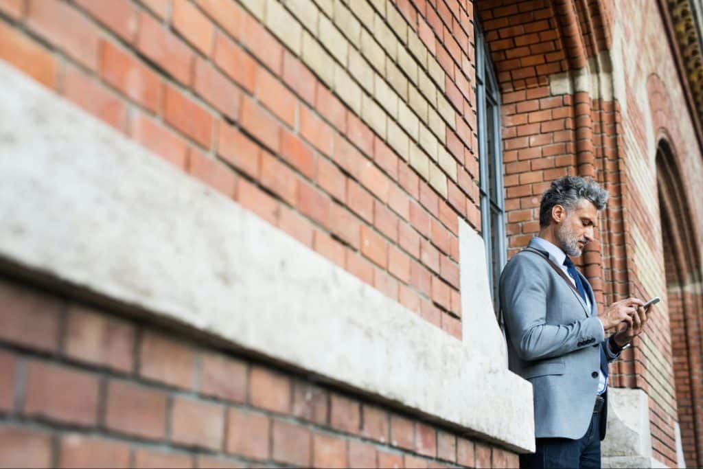 A man texting a woman