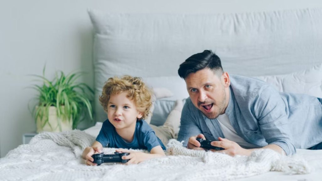 Father learning about his children’s digital hobbies at home.