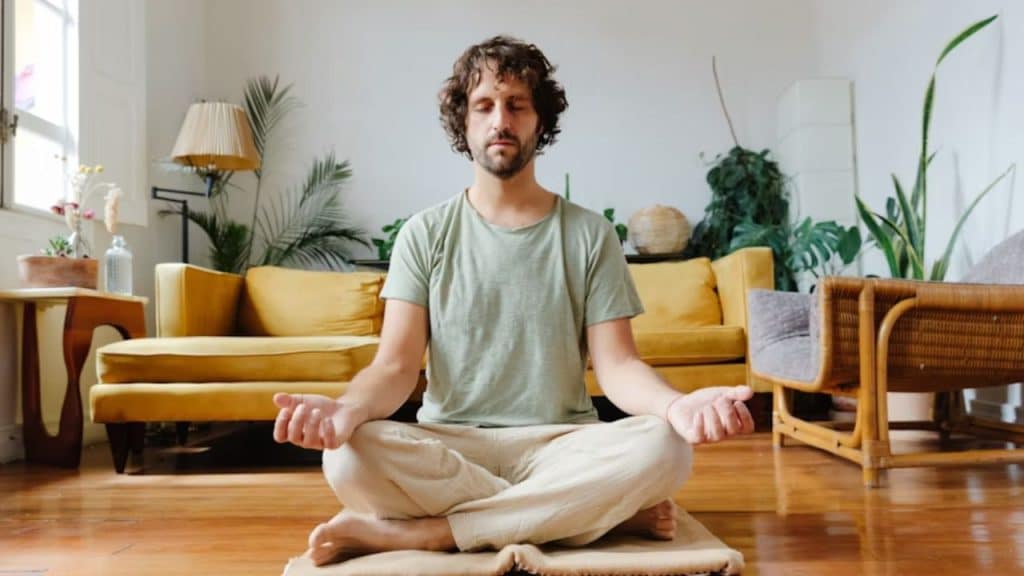 Man meditating in a quiet space