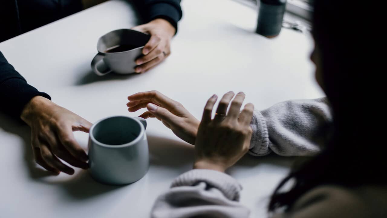 A couple having coffee together.
