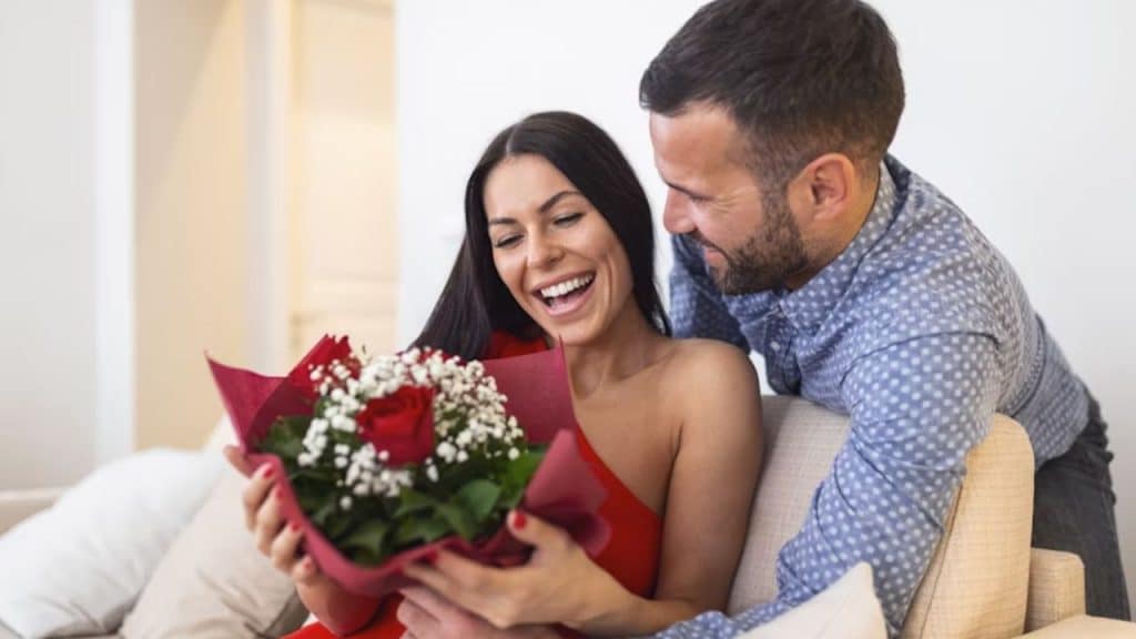 Man giving his partner flowers