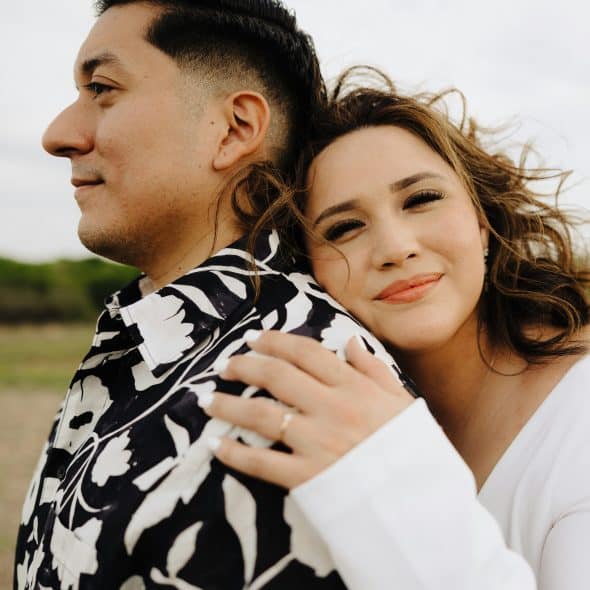 A woman hugging a man.