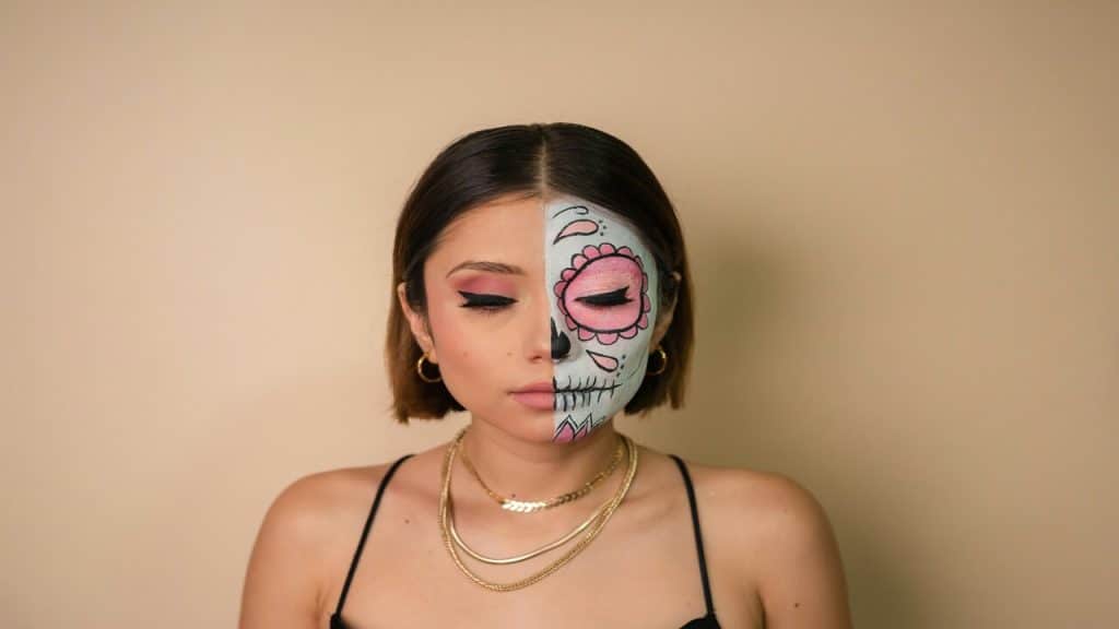 A woman with half her face painted