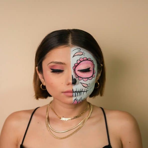 A woman with half her face painted