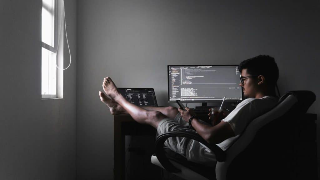 A man relaxing while working from home.