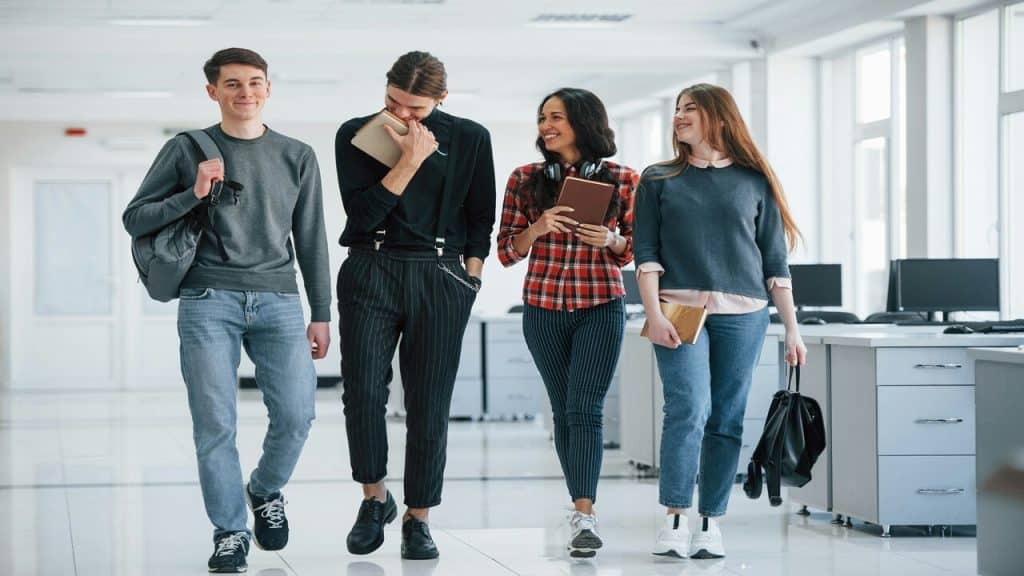 A group of friends about to leave the office.