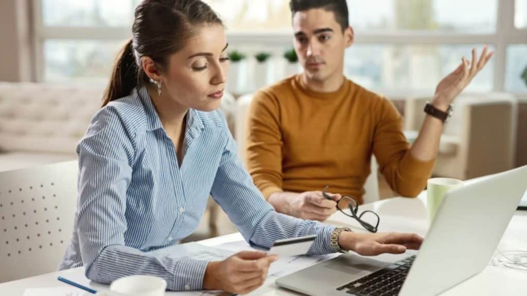 Woman excitedly talking while man shows no engagement.
