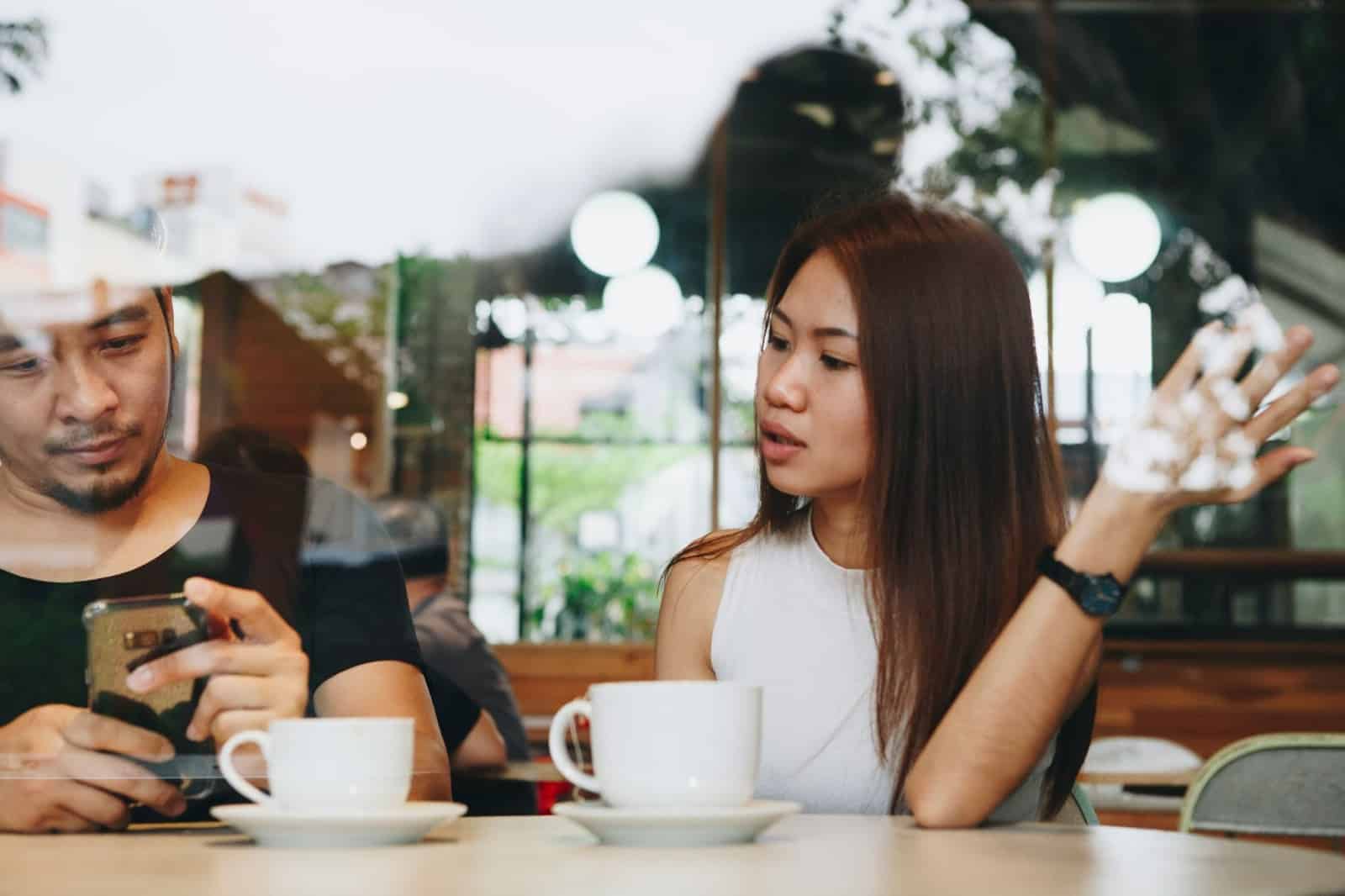 A man and woman at the coffee shop.