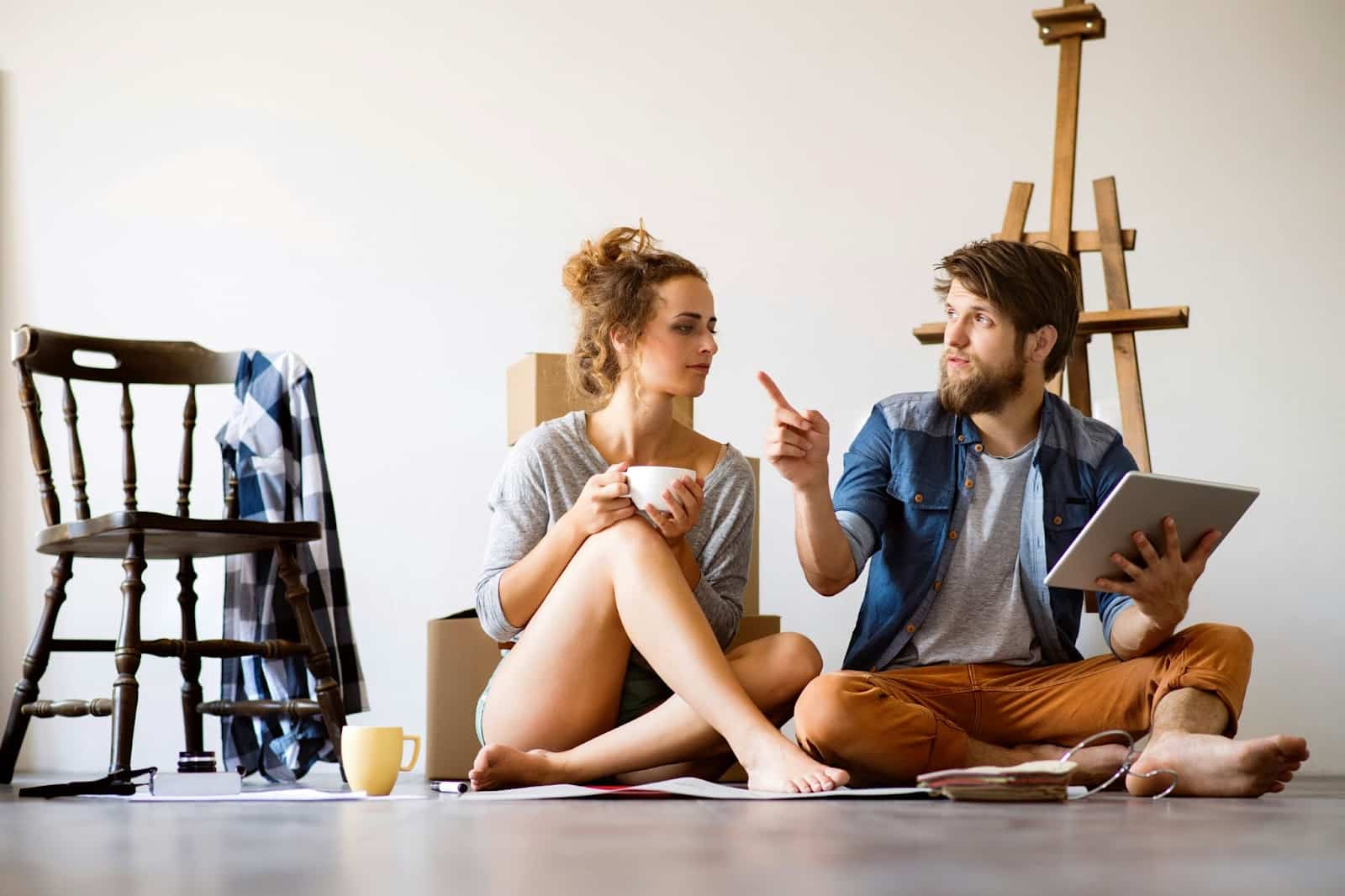 A man and woman talking about the house.