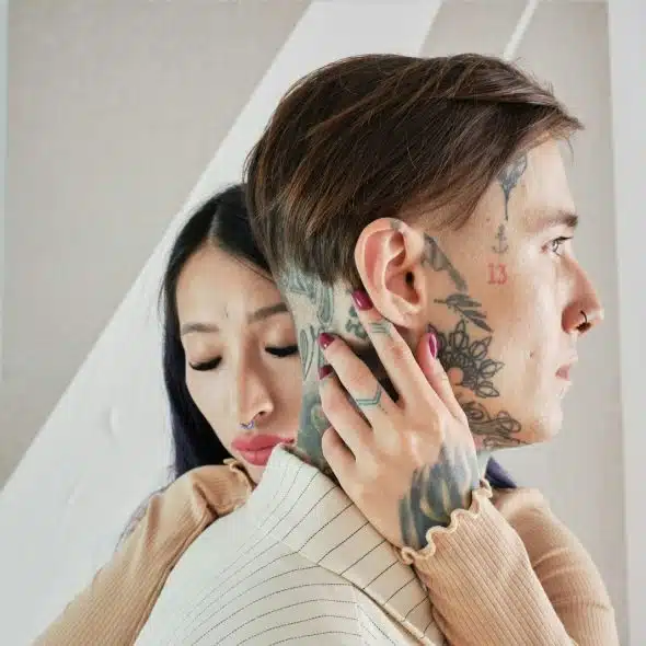 A woman hugging a man.