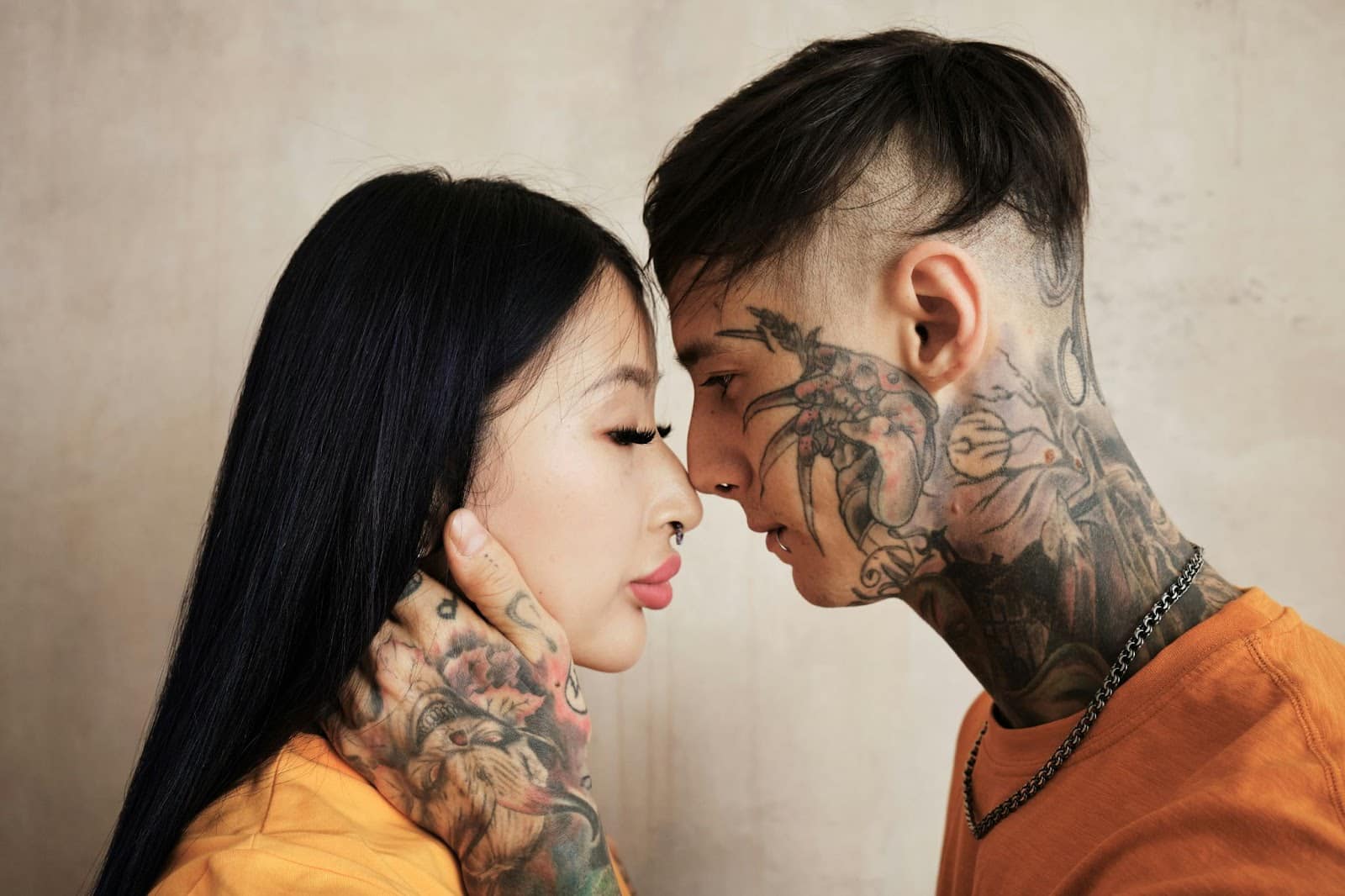 A man and woman facing each other.