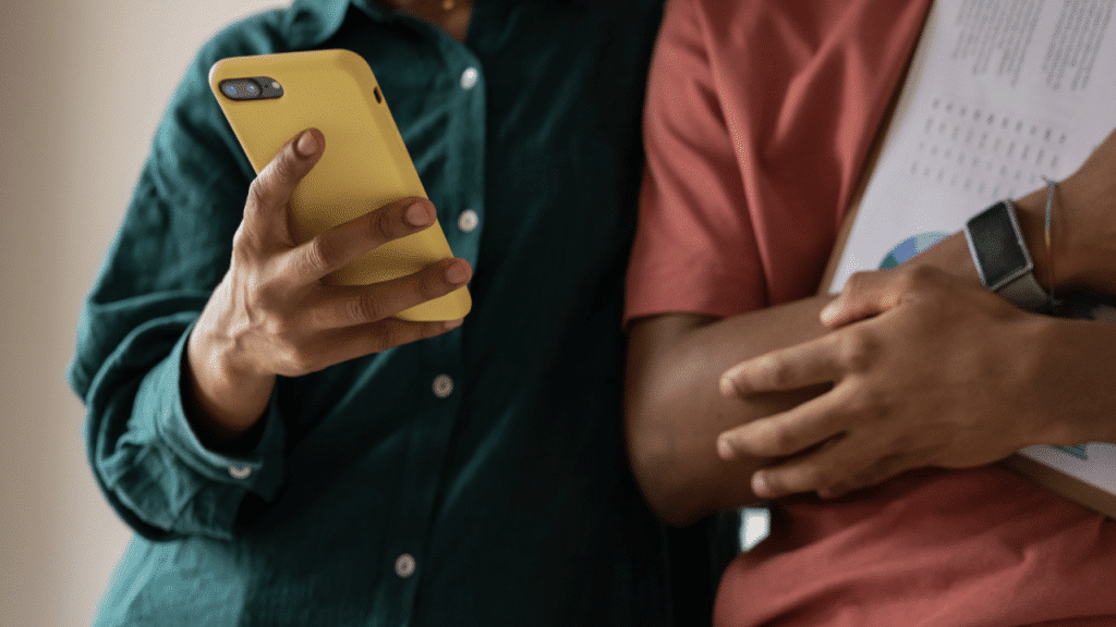 A woman showing something on her phone