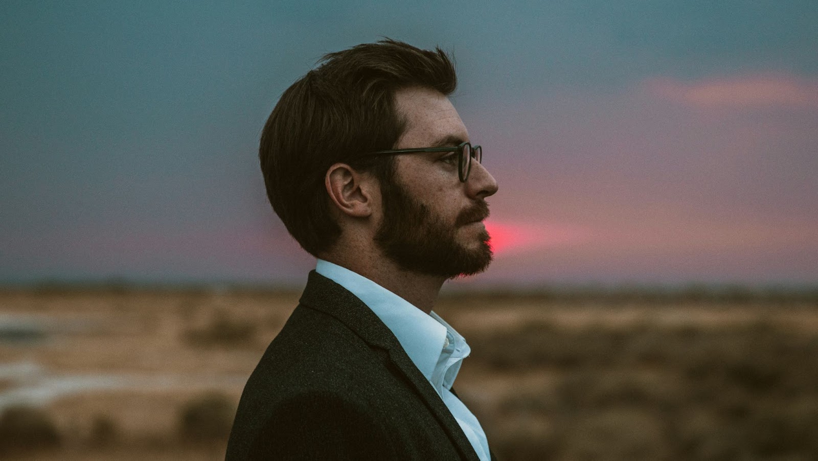 A man looking at his side.