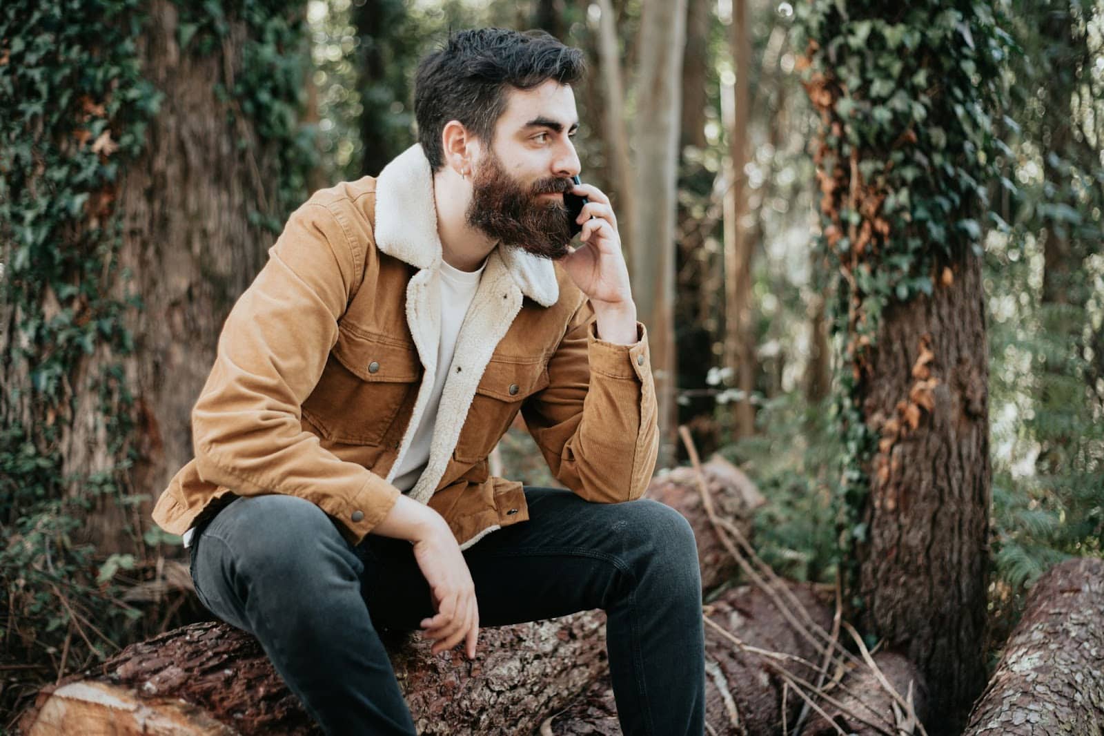 A man sitting in the woods.