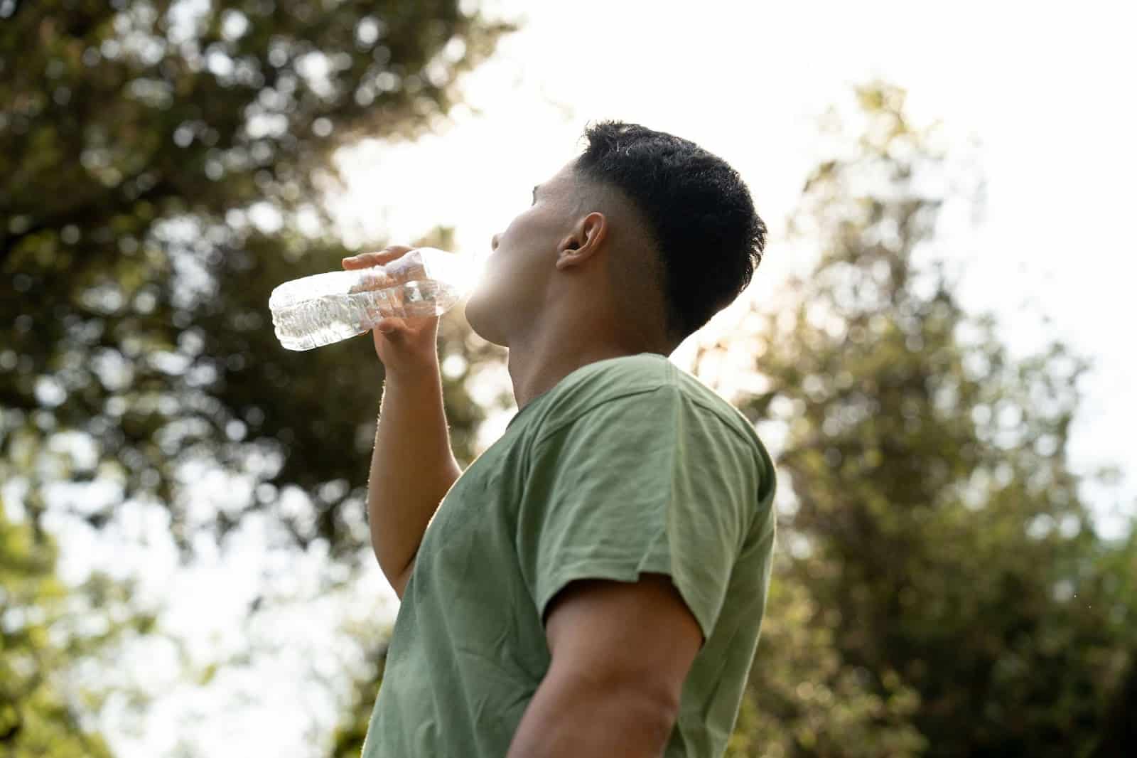 A man drinking a water.