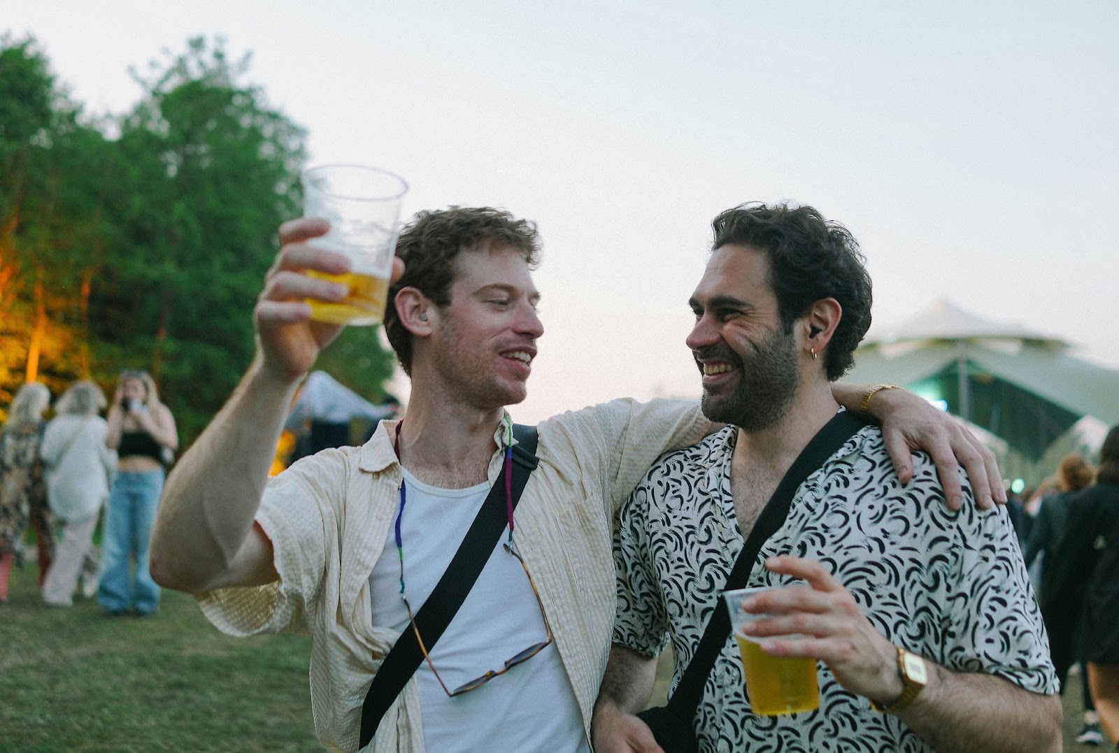 Two men drinking beer.